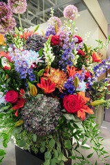 beautiful bouquet of ready-made flowers. Hydrangeas, roses, gerberas, chrysanthemums in flower solution. The combination of different types of flower plants in the florist's solution