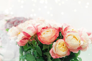 Two-tone romantic roses. Floral background with soft focus. A bouquet of roses on the counter in a flower shop. copy space