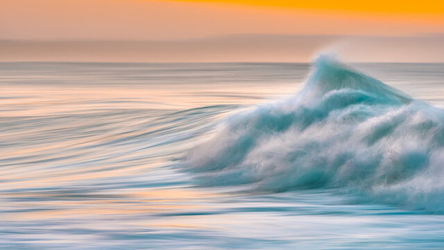 Early morning waved at sunrise in Victoria Bay, Western Cape