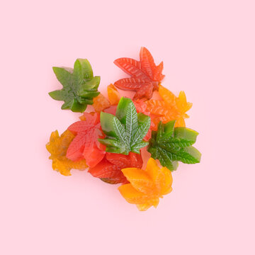 Colorful jelly candies with cbd oil on pastel pinky background