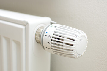 Thermostatic head and radiator valve. Close-up view. Energy saving and save money concept with copy...