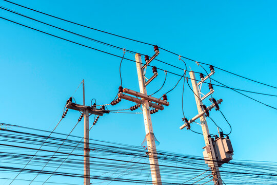 High voltage electricity pylon for electric supply transmission with blue sky, Power distribution technology and generator infracstructure equipment