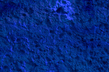 texture of a blue wall covered with with torn old paper and plaster, style grunge, space for text, space for copy