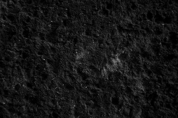 Fototapeta premium texture of a grey wall covered with with torn old paper and plaster, style grunge, space for text, space for copy