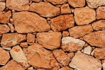 texture of a old red stone wall mediterrranean spain architecture, wall background