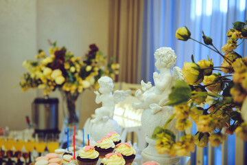 angel statues on candy bar table
