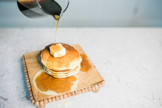 Fresh Homemade Pancakes with Butter and Maple Syrup 