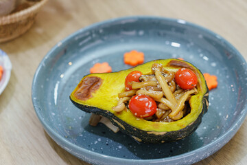 Roasting butternut squash pumpkin with mushrooms and tomato rosemary delicious clean food.