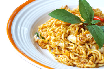 Blurry Spicy Stir Fried Mama, stir-fried instant noodles with fresh Spicy mama basil with egg selective focus