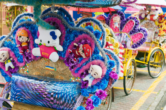 malacca - january 11, 2014: logo and sign of the character hello kitty on a cyclo in malacca