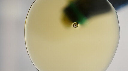 Pouring oil to the bottom of the pan. view from the bottom of the pan. Shooting through glass from bottom to top. Pouring Oil Liquid. Oil Splashing and Flowing