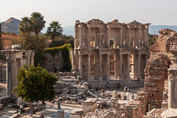 Fototapeta na wymiar The Celsus Library in Ephesus - Selcuk (Izmir), Turkey. Ruins of ancient city. Beautiful facade of an old building of an ancient civilization. Seven Wonders of the World.