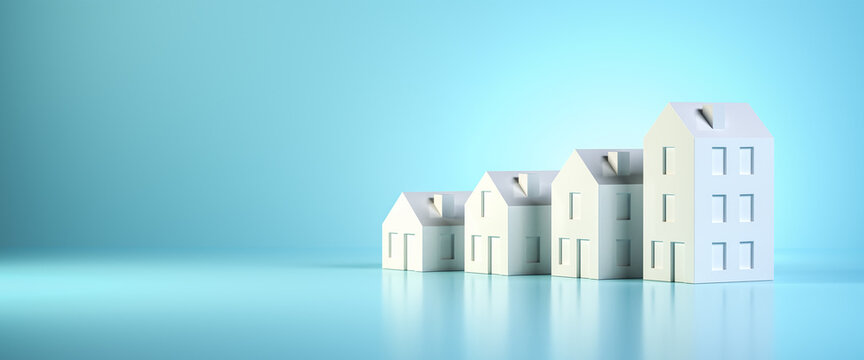 Which size of house can you afford? Concept shot: four differently sized models of houses on a blue background. Copy space available, web banner format