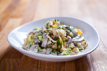 Tagliatelle pasta with asparagus mushrooms and basil in sour cream sauce. Italian pasta. fresh pasta 
culinary recipe