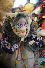 Obraz premium fabric souvenir in the shape of a grandmother with large eyes