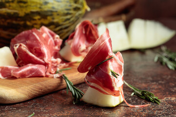 Juicy melon with prosciutto and rosemary.
