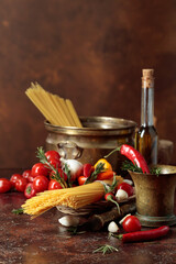 Pasta with ingredients and old kitchen utensils.
