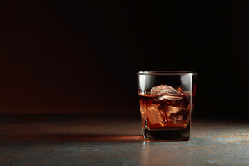 Glass of whiskey on a rusty background. - obrazy, fototapety, plakaty