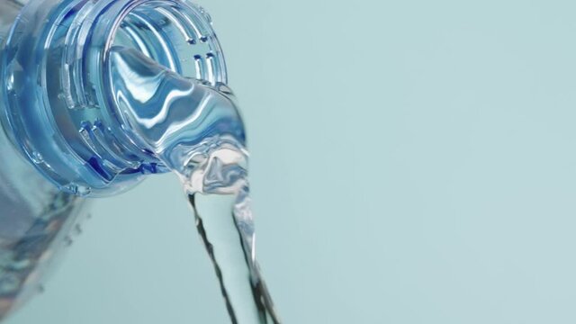 Clean water pours from the bottle