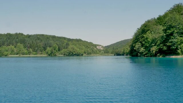 Tourist boat floating on the Kozjak Lake in Plitvice, National Park in Croatia, UNESCO world heritage