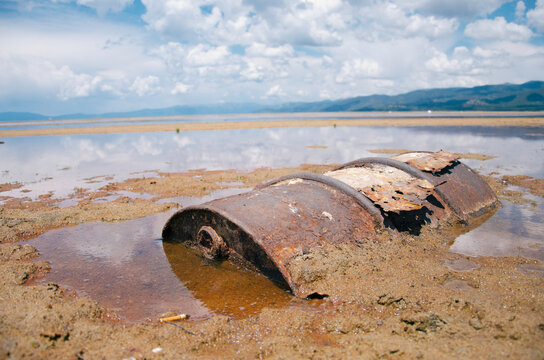 Rusted Gas Can Stuck In The Ground Of Dried Up Lake