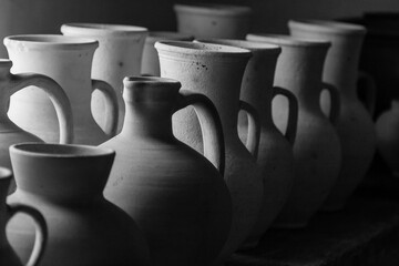 Fototapeta na wymiar Clay pots and vases of different sizes