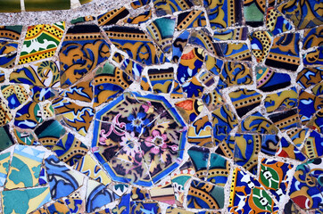 Broken glass mosaic tile, decoration in the Park Guell, Barcelona, ​​Spain