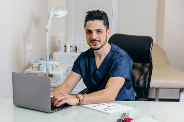 A young arabic or turkish doctor in a blue uniform conducts online counseling