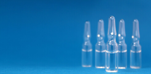 medicine bottles close up on blue background