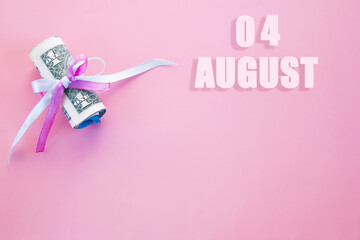 calendar date on pink background with rolled up dollar bills pinned by pink and blue ribbon with copy space.  August 4 is the fourth day of the month