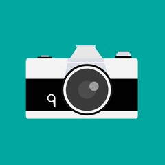 Retro camera or vintage camera in a flat style on a colored background.