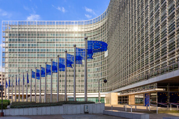 Row of EU Flags in front of the European Union Commission building in Brussels - 421587370