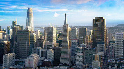 Great aerial view of San Francisco skyline, famous buildings over a cloudy sky. Financial district with its skyscrapers. California, United States.