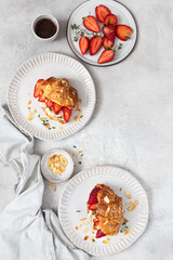 Croissant sandwich with camembert cheese   and strawberry 