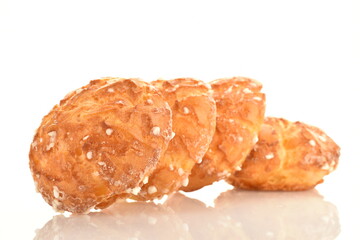 Several sweet chouquette, close-up, isolated on white.