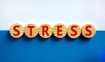 Stop stress and be health symbol. Wooden circles with the word 'stress'. Beautiful white and blue...