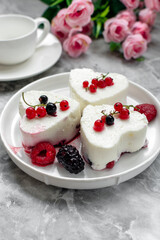 Panna Cotta with fresh berries on white plate. Delicious homemade dessert as tasty breakfast