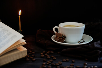 Cup with coffee and coffee beans