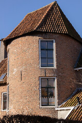 Fototapeta na wymiar Medieval city wall tower part of the former fortification works around Hanseatic Zutphen, The Netherlands. Dutch cultural heritage site