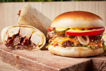 Kebab Shawarma Hamburger and Closed Pizza on Round Wooden Based