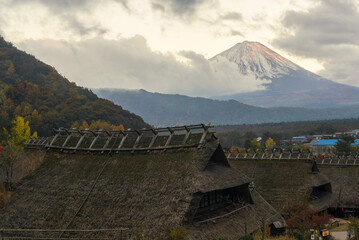 Views of the peak of Mt Fuji covered in snow as seen from the historical town of Iyashinosato