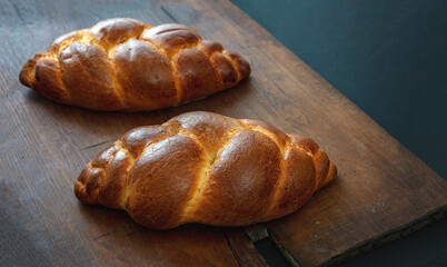 Easter tsoureki braid, greek easter sweet bread, on wooden background