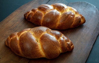 Easter tsoureki braid, greek easter sweet bread, on wooden background