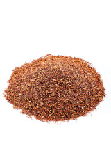 Rooibos tea, strawberries. Pile of natural rooibos tea with leaves on white background.