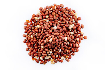 A heap of peanuts on a white background. Close-Up of peanuts with a white background. Peanuts isolated on white background top view. Flat lay