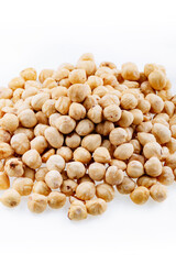 Roasted hazelnuts. A bunch of hazelnuts on a white background. Raw hazelnuts isolated over white background. Roasted hazelnuts background.