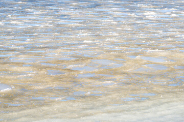 Frozen crystallized water and ice, on the surface of the ocean, with a slight skim of frozen water....