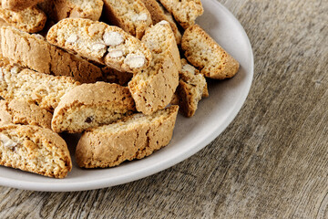 Heap of Cantuccini cookie biscuits with almonds nuts. Crunchy traditional Italian snack.