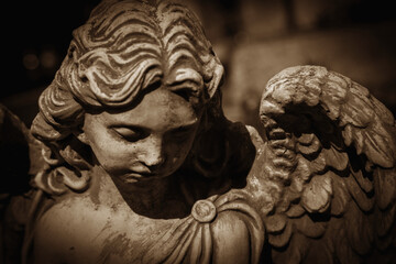 Fototapeta na wymiar Retro styled antique statue of angel of death. Close up.