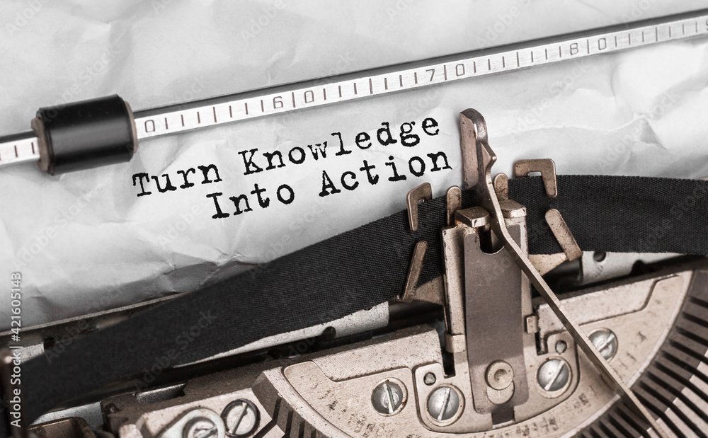 Poster text turn knowledge into action typed on retro typewriter